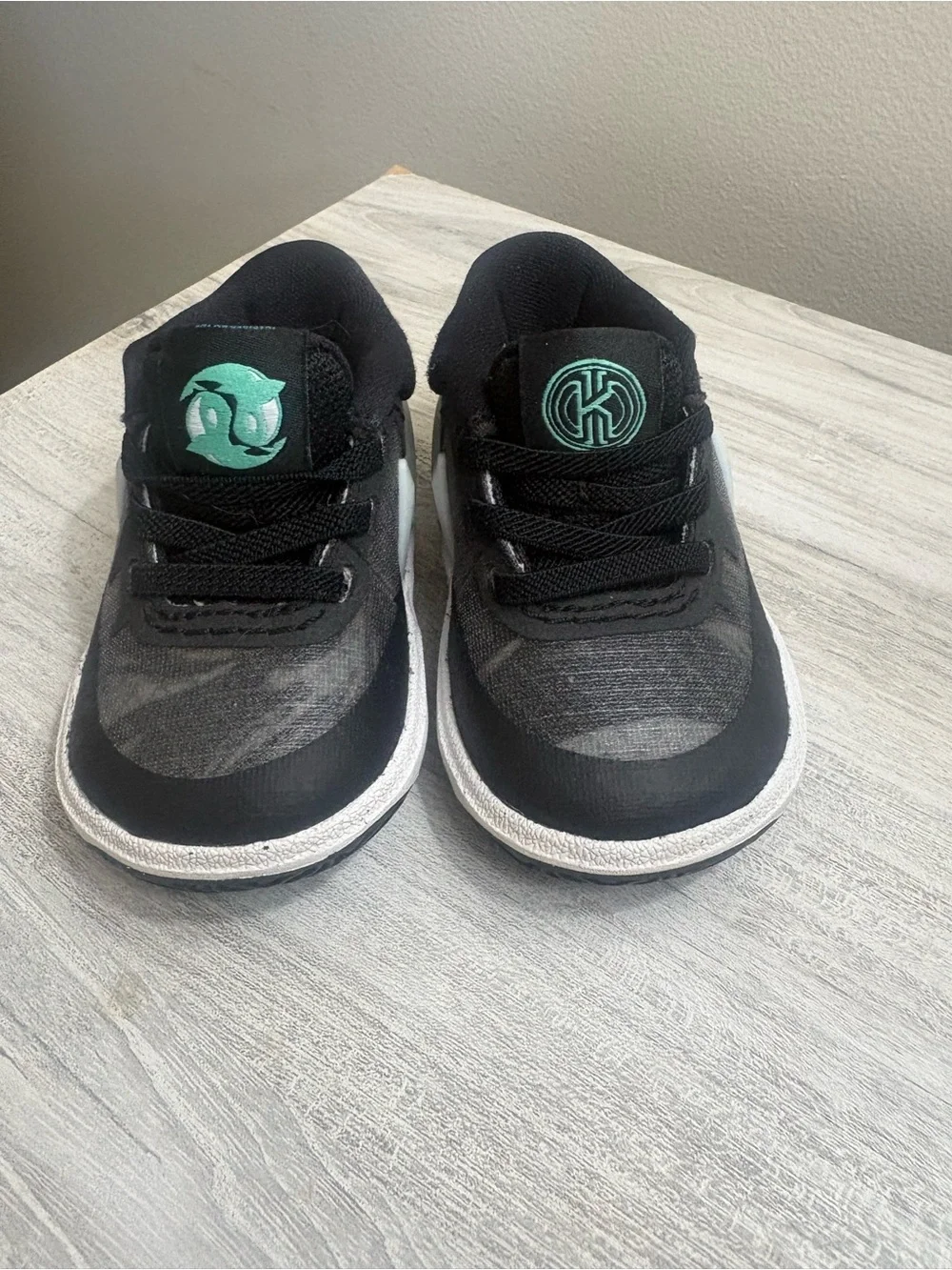 Nike Kids Black Sneakers with Teal Accents